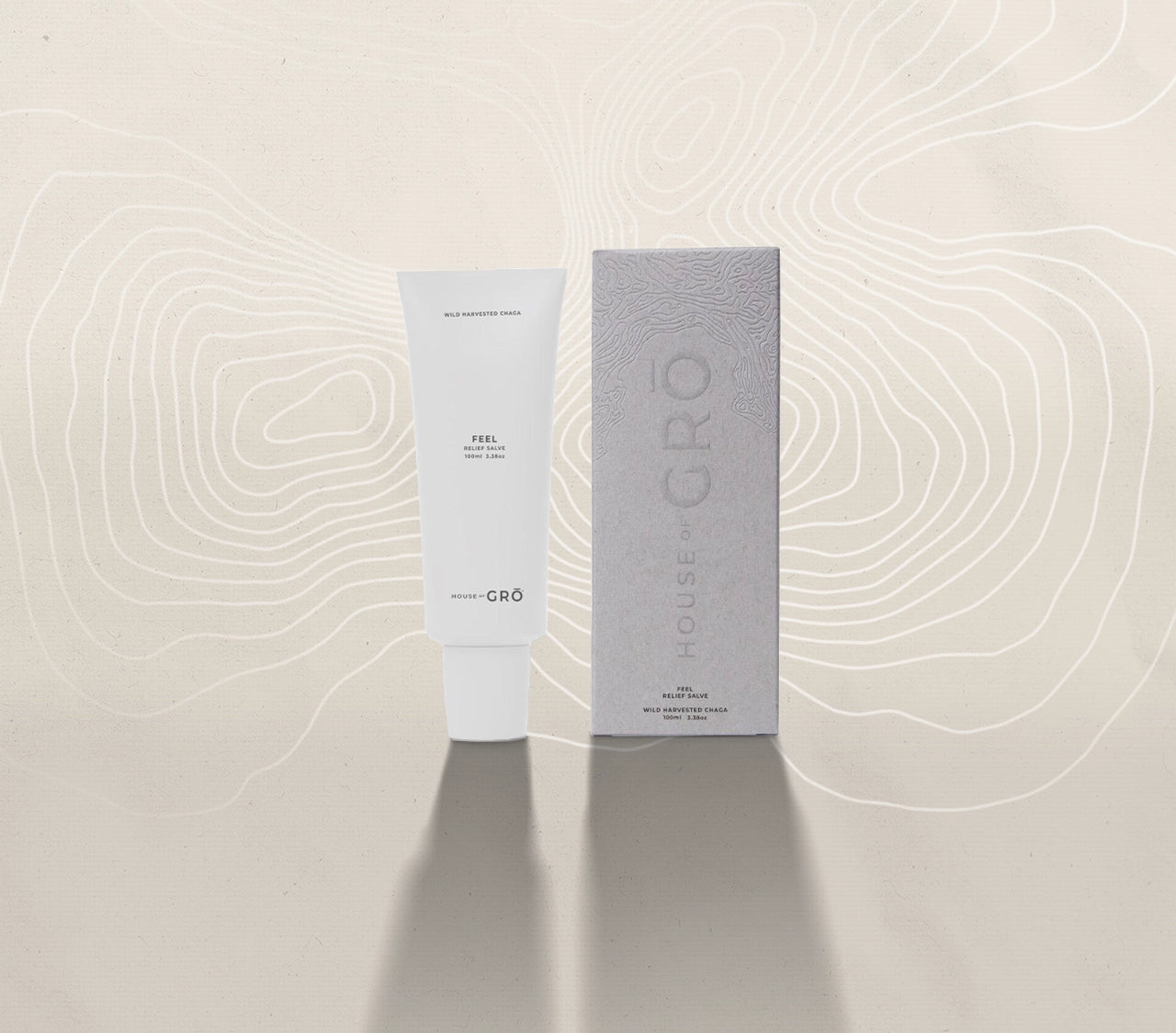 House of GRŌ Feel Relief Salve tube and its textured retail packaging box on a light background.