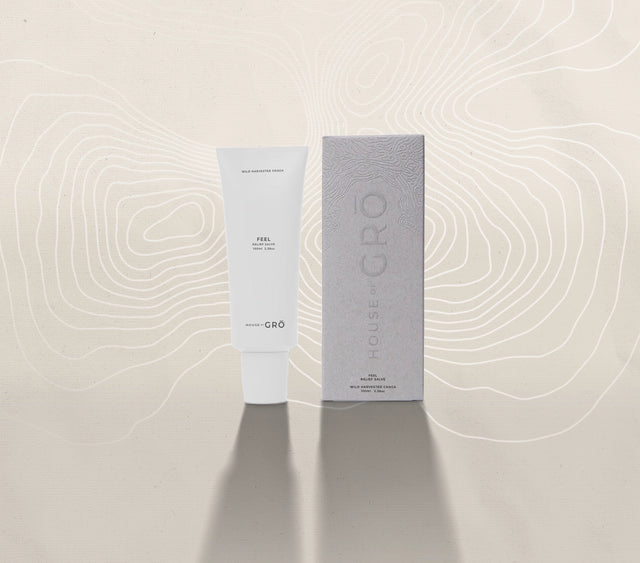 House of GRŌ Feel Relief Salve tube and its textured retail packaging box on a light background.